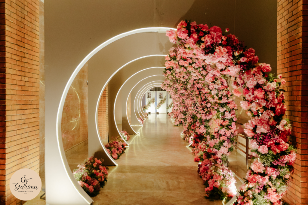 outdoor wedding decoration with floral arrangements and natural greenery