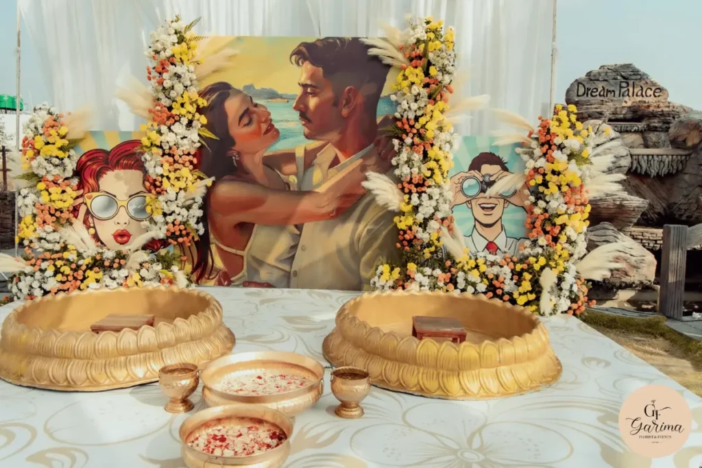 colourful Haldi ceremony backdrop with floral arrangements and gold seating